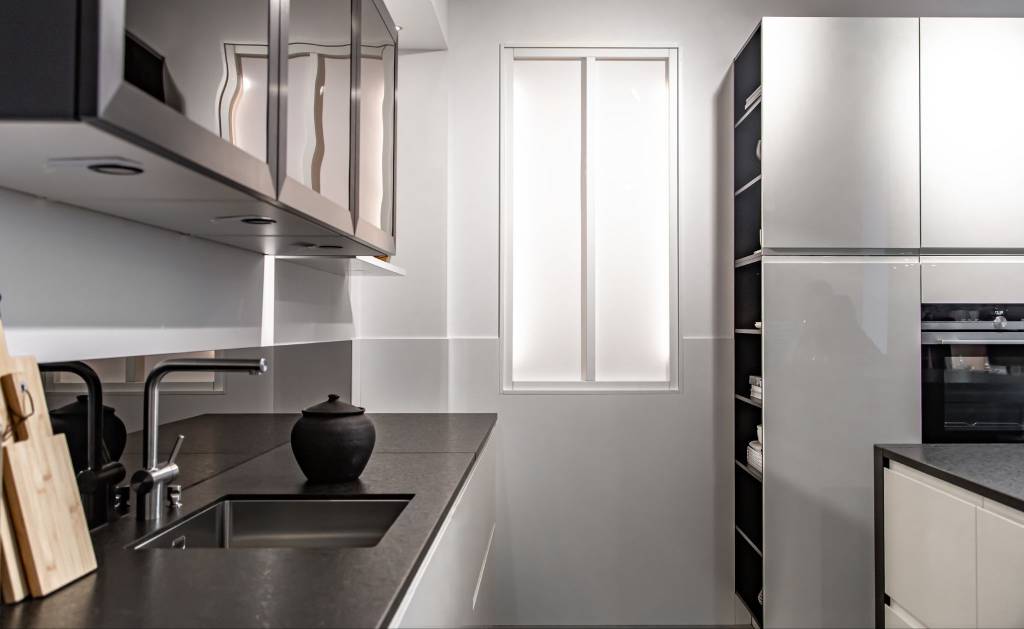 Black and white kitchen interior with modern cabinetry and clean lines